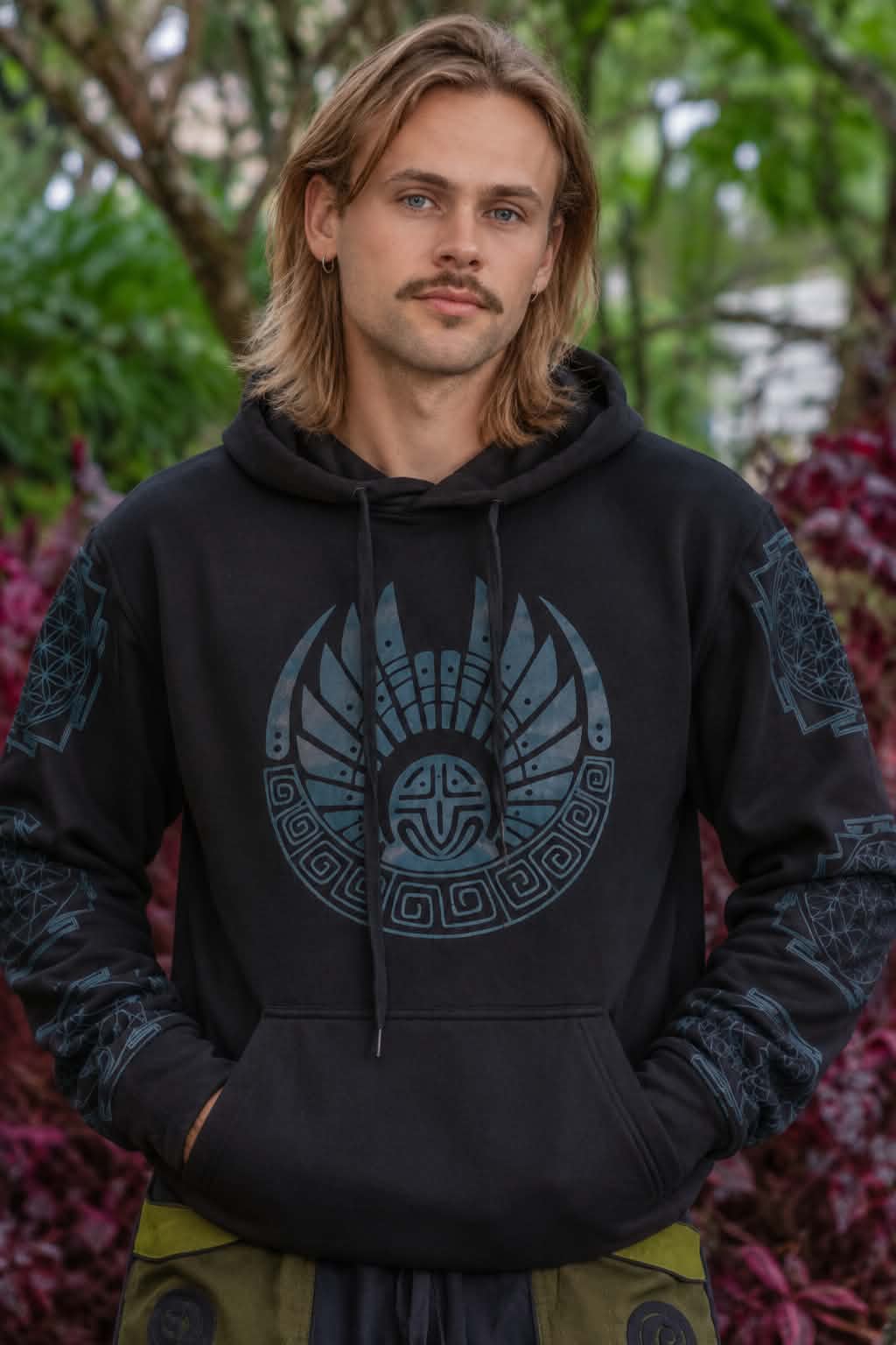 Close-up of men’s black fleece-lined hoodie with blue tribal geometric chest and sleeve print