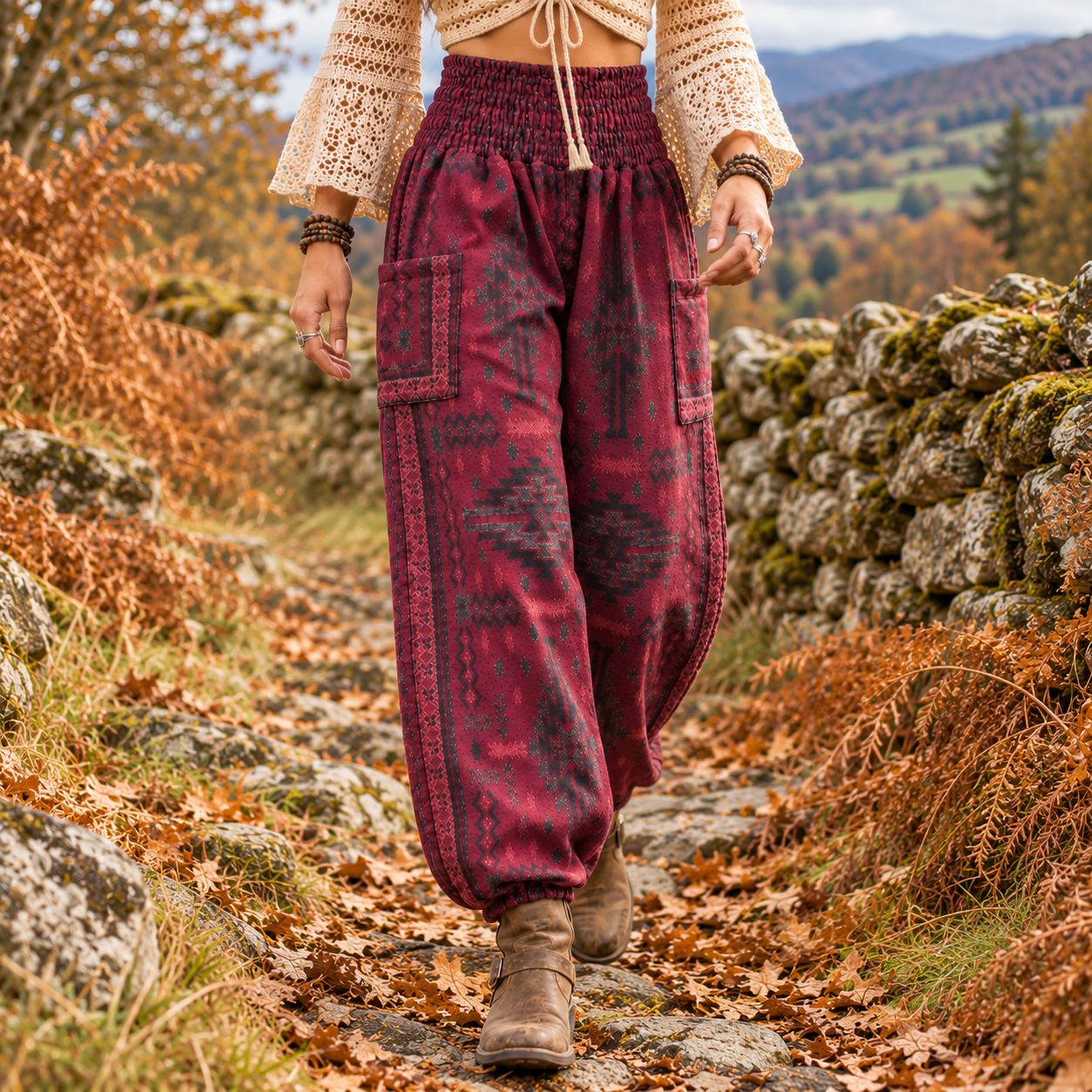 Woman in an autumn boho outfit wearing warm maroon patterned harem trousers made from soft vegan friendly fabric