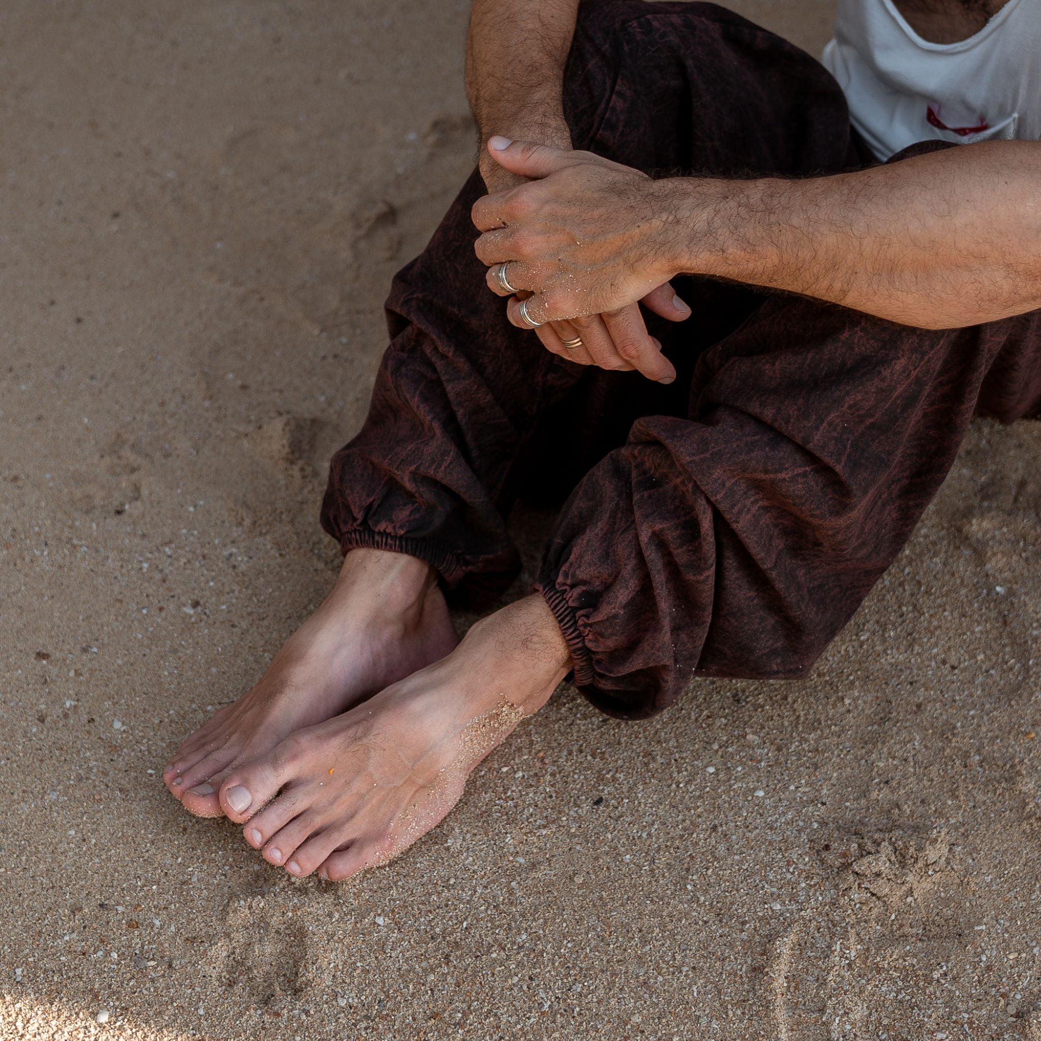 Elasticated ankle cuff detail on men's brown stonewashed harem pants, festival trousers