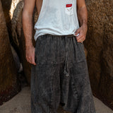 Close-up of drawstring waistband on men's charcoal grey stonewashed drop crotch harem pants