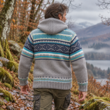 Back view of men’s brown Fairtrade wool jacket showing navy and sea green knitted pattern and detachable hood