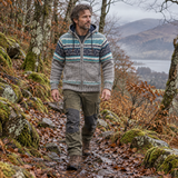 Man wearing a warm Fairtrade wool jacket on a woodland walk, handmade in Nepal with fleece lining