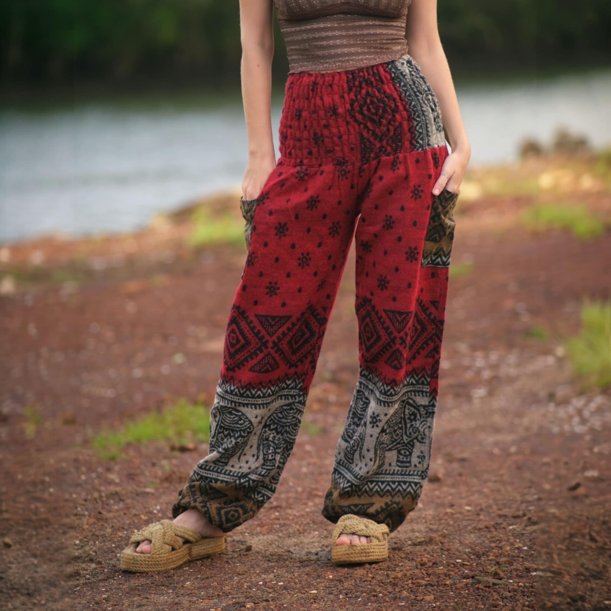 Red elephant print warm harem blanket pants with smocked waistband and side pockets, soft cashmilon fleece-style trousers for yoga, lounging, festivals and boho style