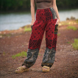 Red elephant print warm harem blanket pants with smocked waistband and side pockets, soft cashmilon fleece-style trousers for yoga, lounging, festivals and boho style