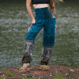 Turquoise teal elephant print warm harem blanket pants with smocked waistband and side pockets, soft cashmilon fleece-style trousers for yoga, lounging, festivals and boho fashion