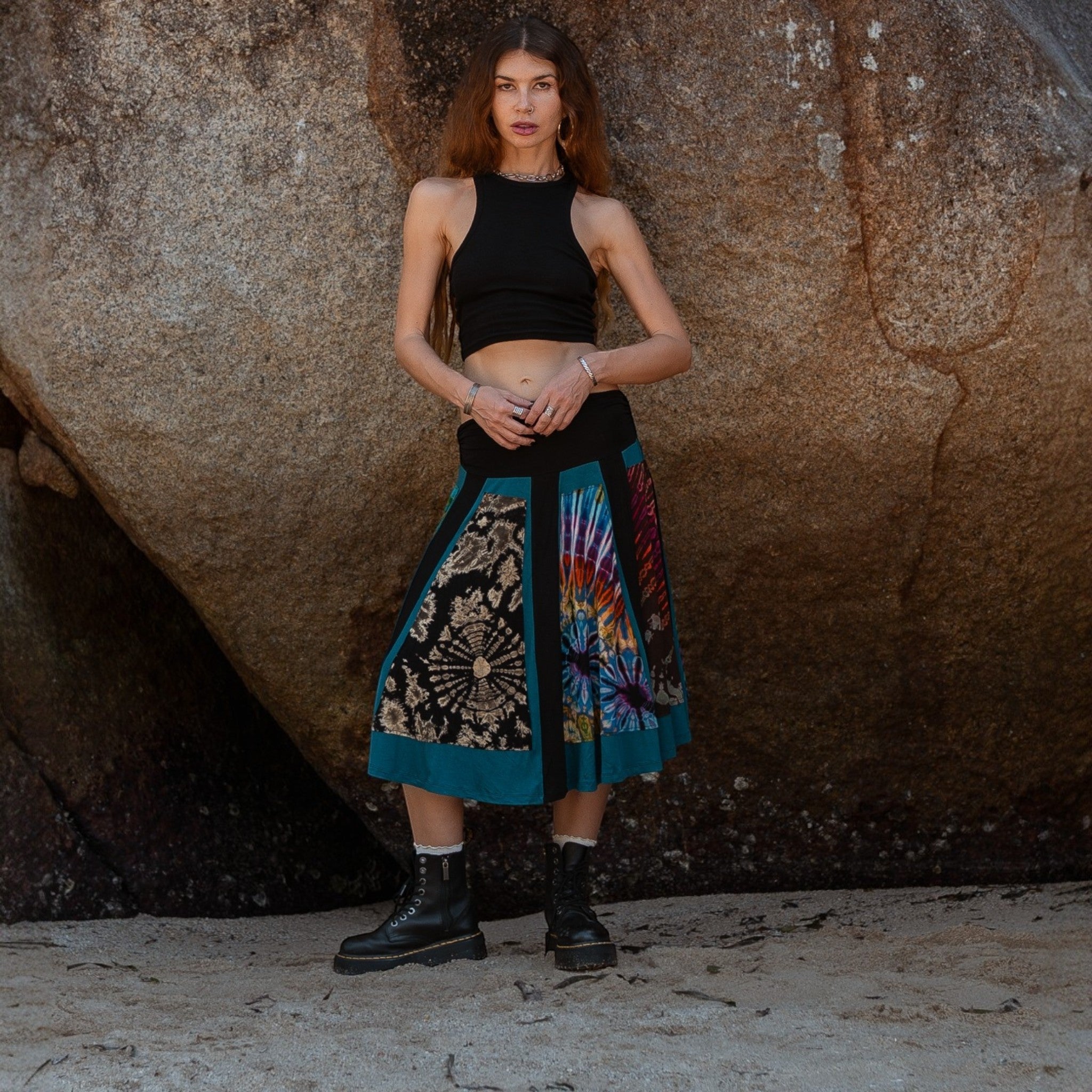 Front view of an artisan patchwork psy skirt with bohemian and tribal inspired designs